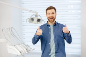 man happy with care laser periodontal work concept